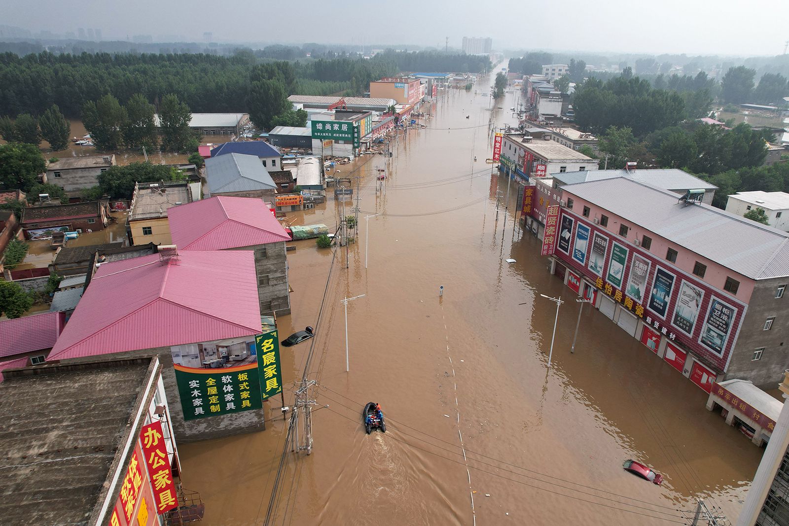 This aerial view shows a flooded village in Zhuozhou after heavy rains on August 2.